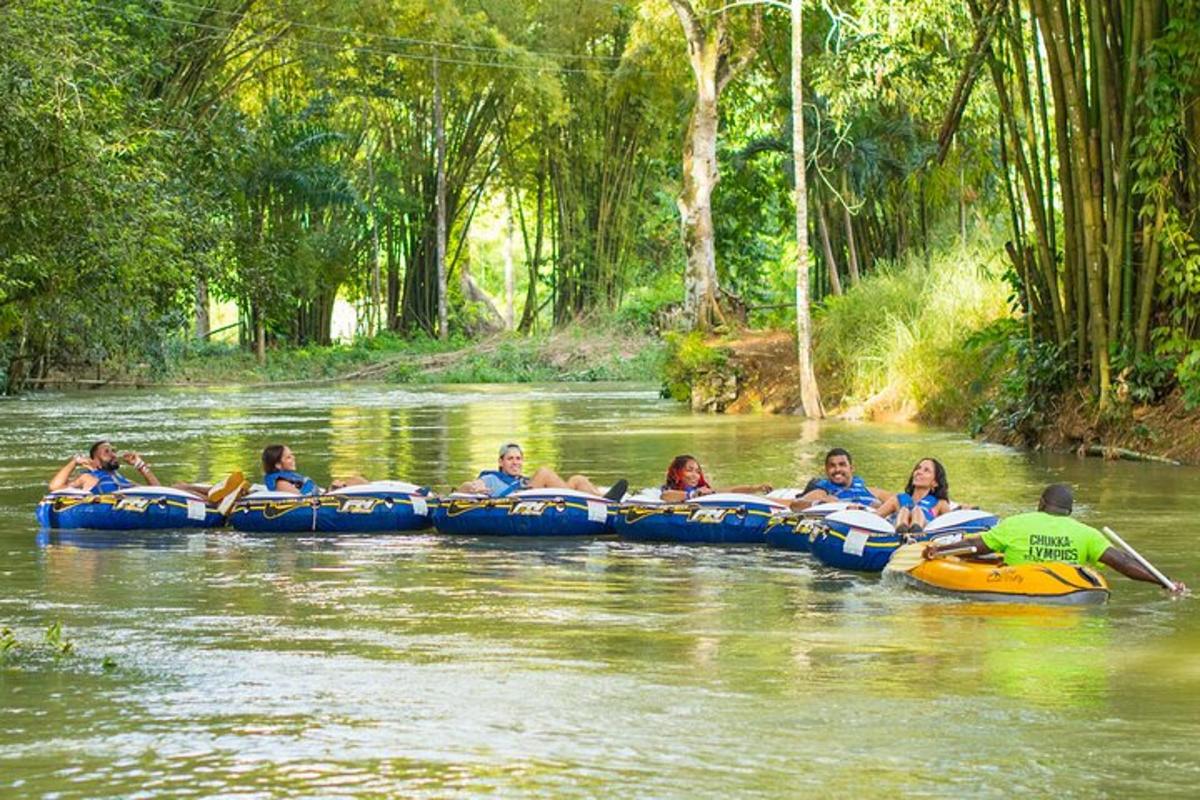 a group of people riding on tubes in a river