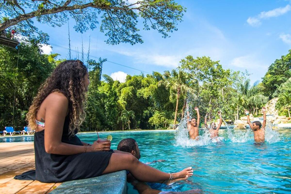 a group of people in the water at a swimming pool