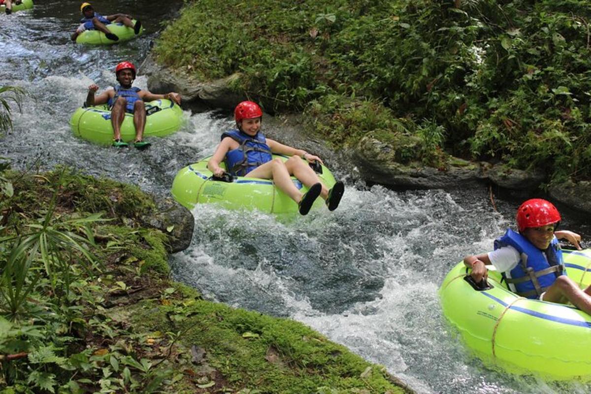 a group of people rafting down a river
