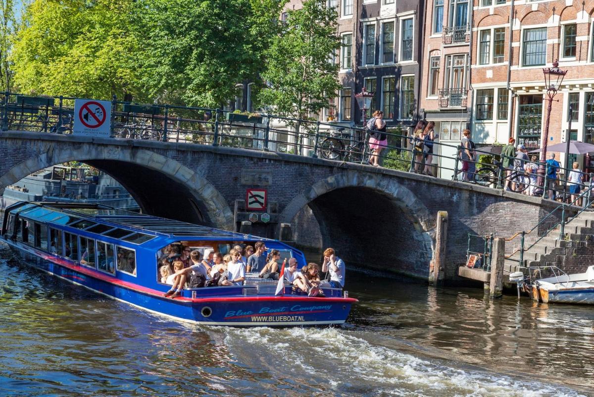a group of people riding a boat down a river