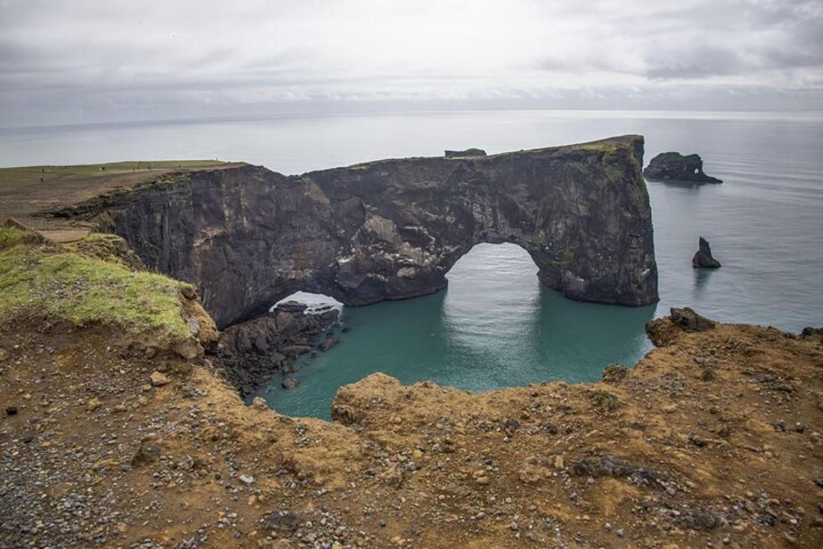 an arch in a rock formation in the ocean