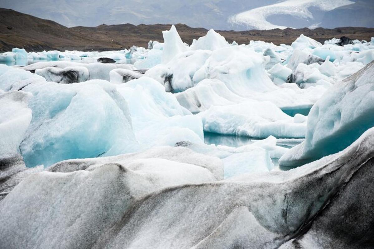 a group of icebergs in a body of water