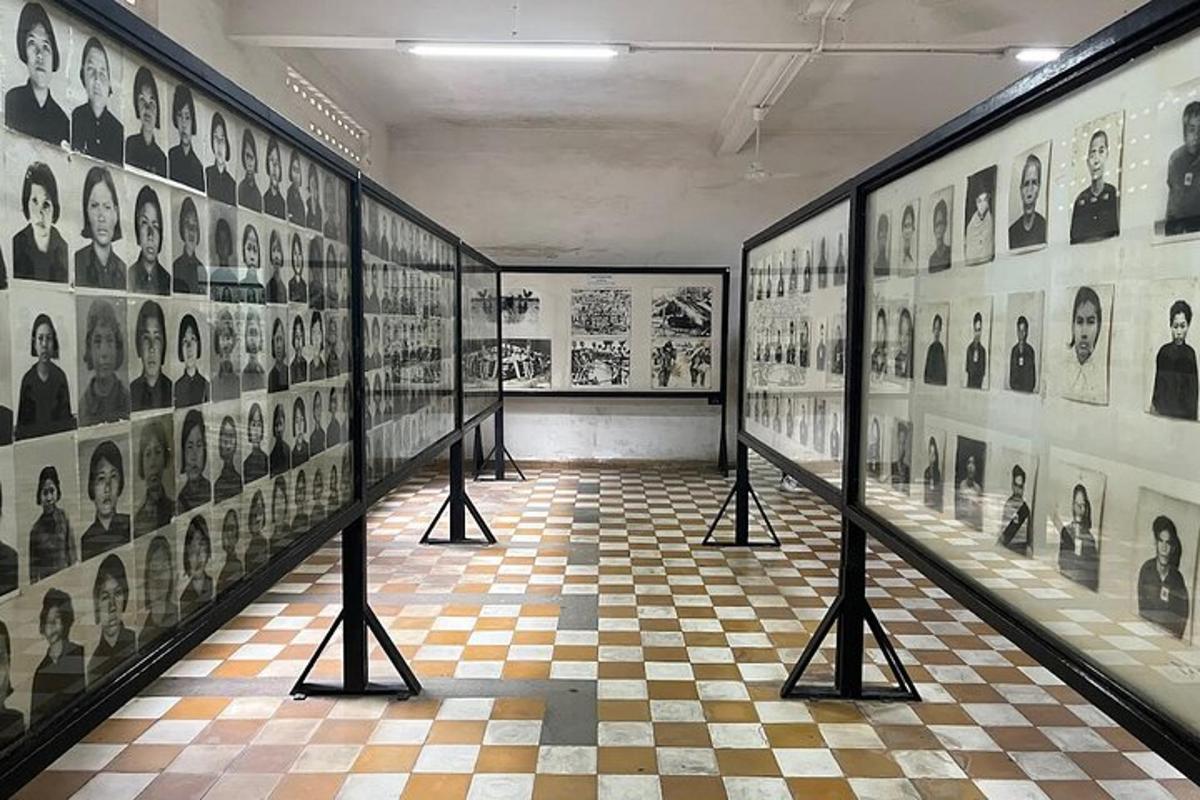 a room with black and white photos on the walls