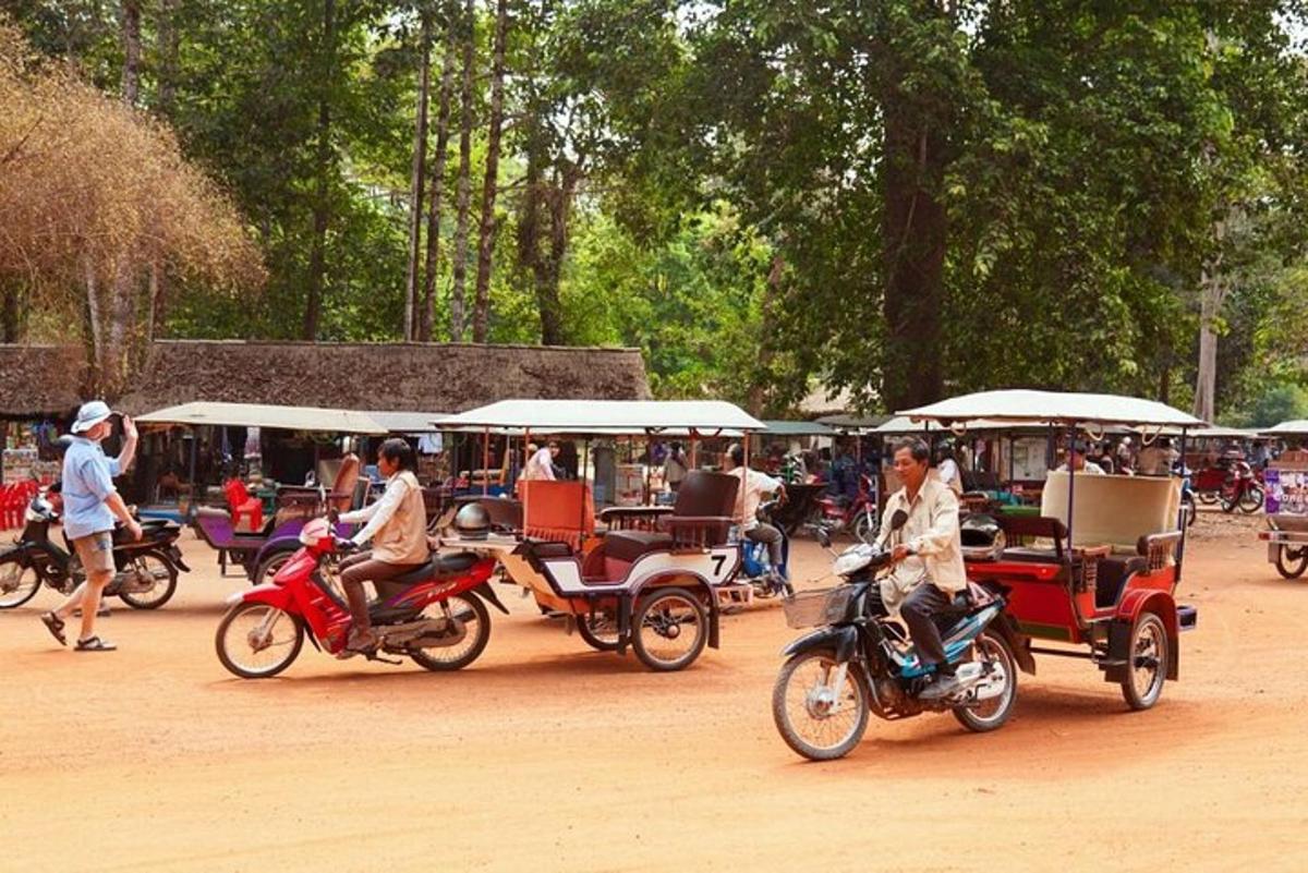 a group of people riding motorcycles and carts