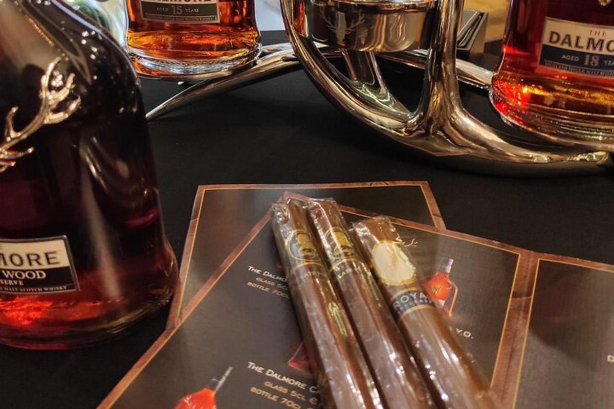 a table with a bottle of whisky and a magazine