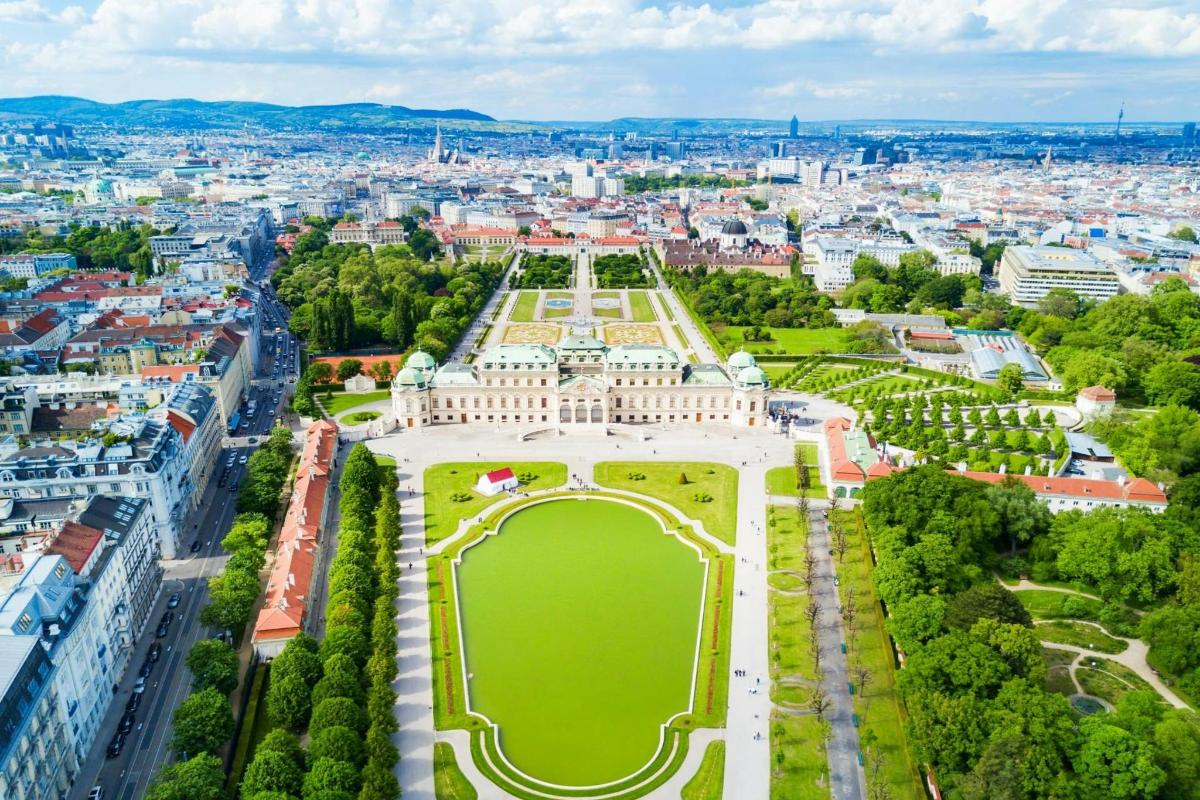 an aerial view of the palace of versailles with a city in the background