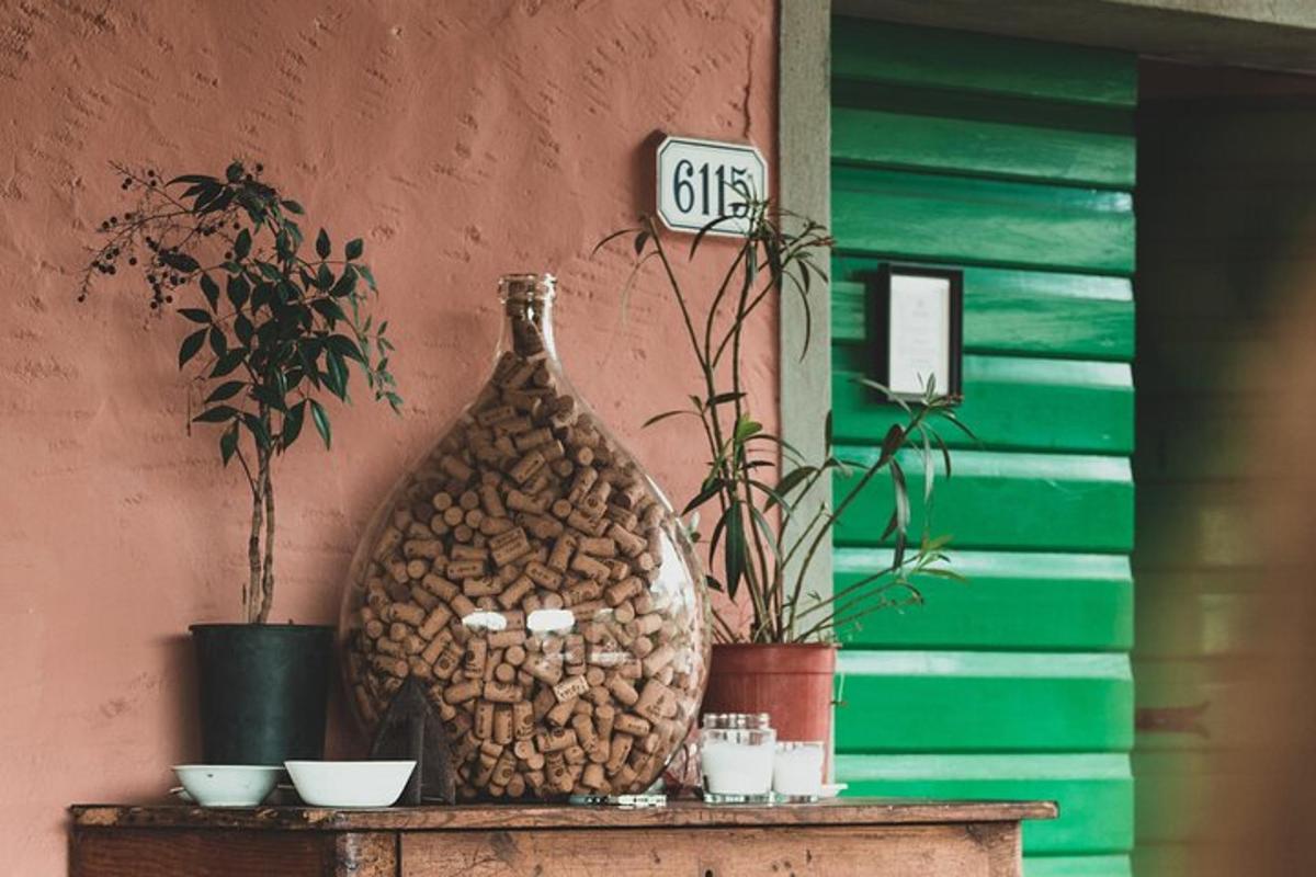 a vase sitting on top of a table with plants