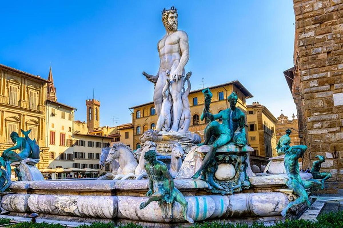 una fontana con una statua di un uomo e delle rane