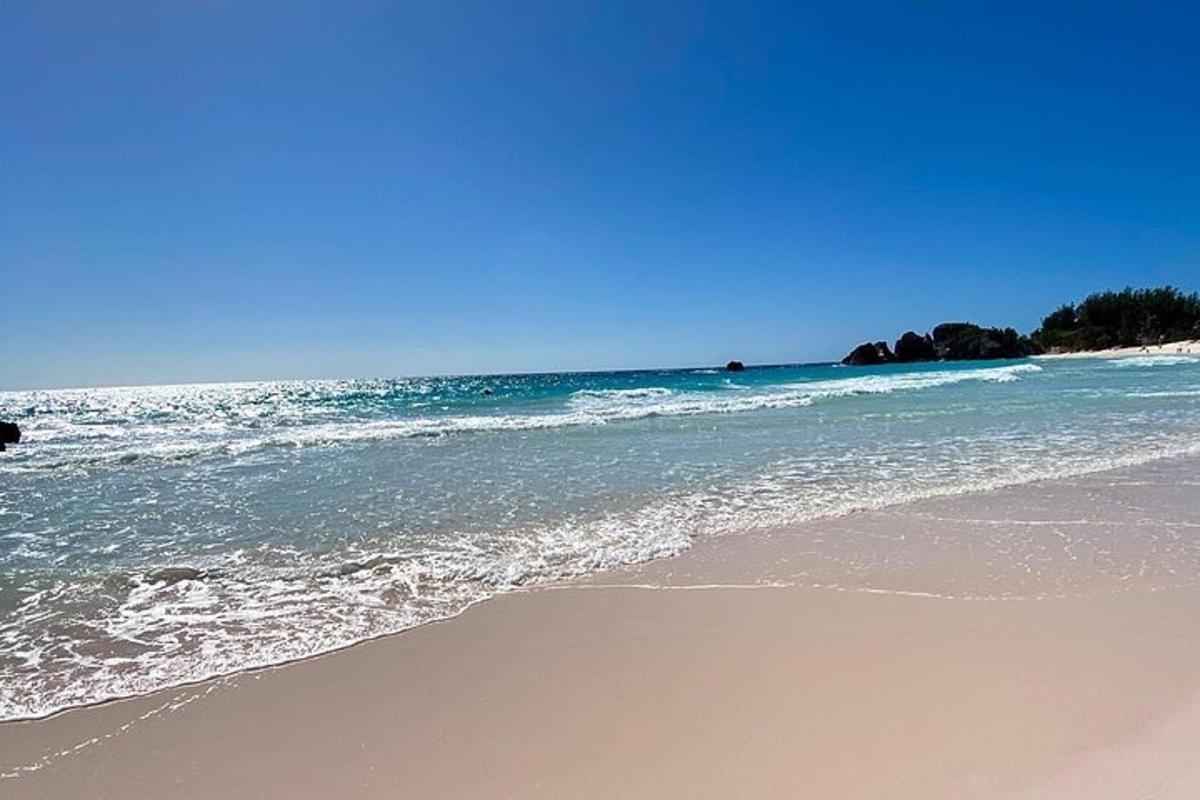 a beach with the ocean and the shoreline