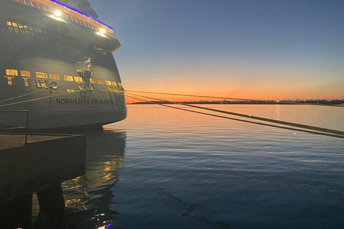 a cruise ship docked at a dock in the water