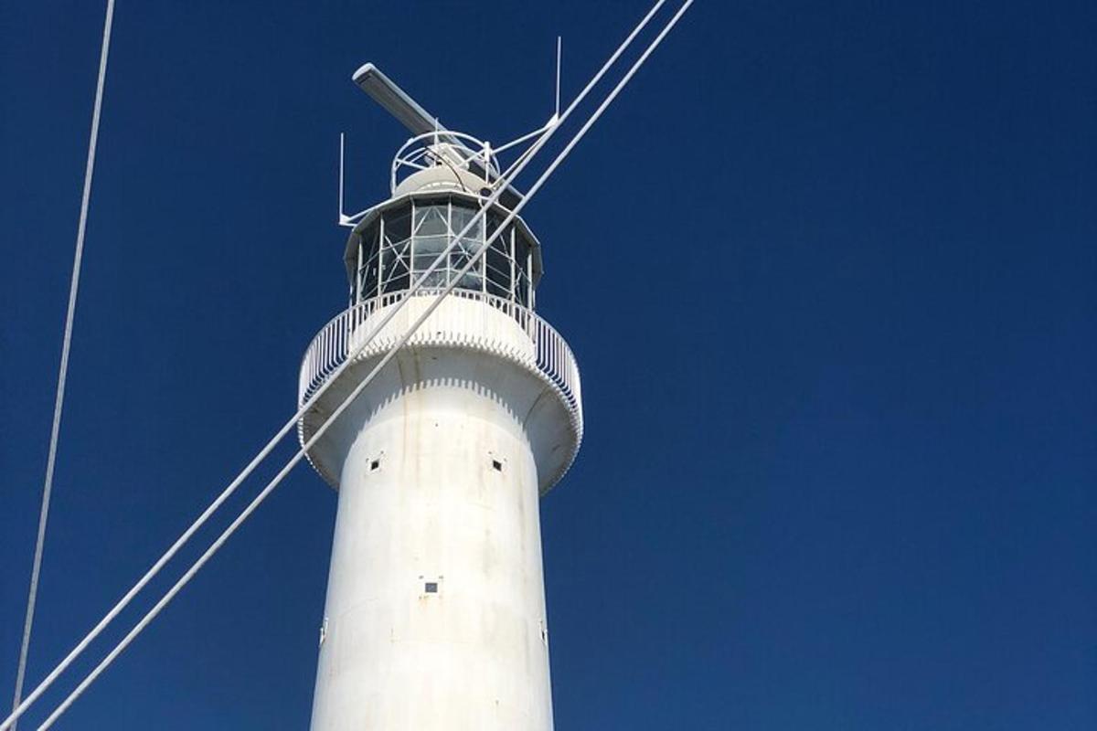 a tower with a wind turbine on top of it