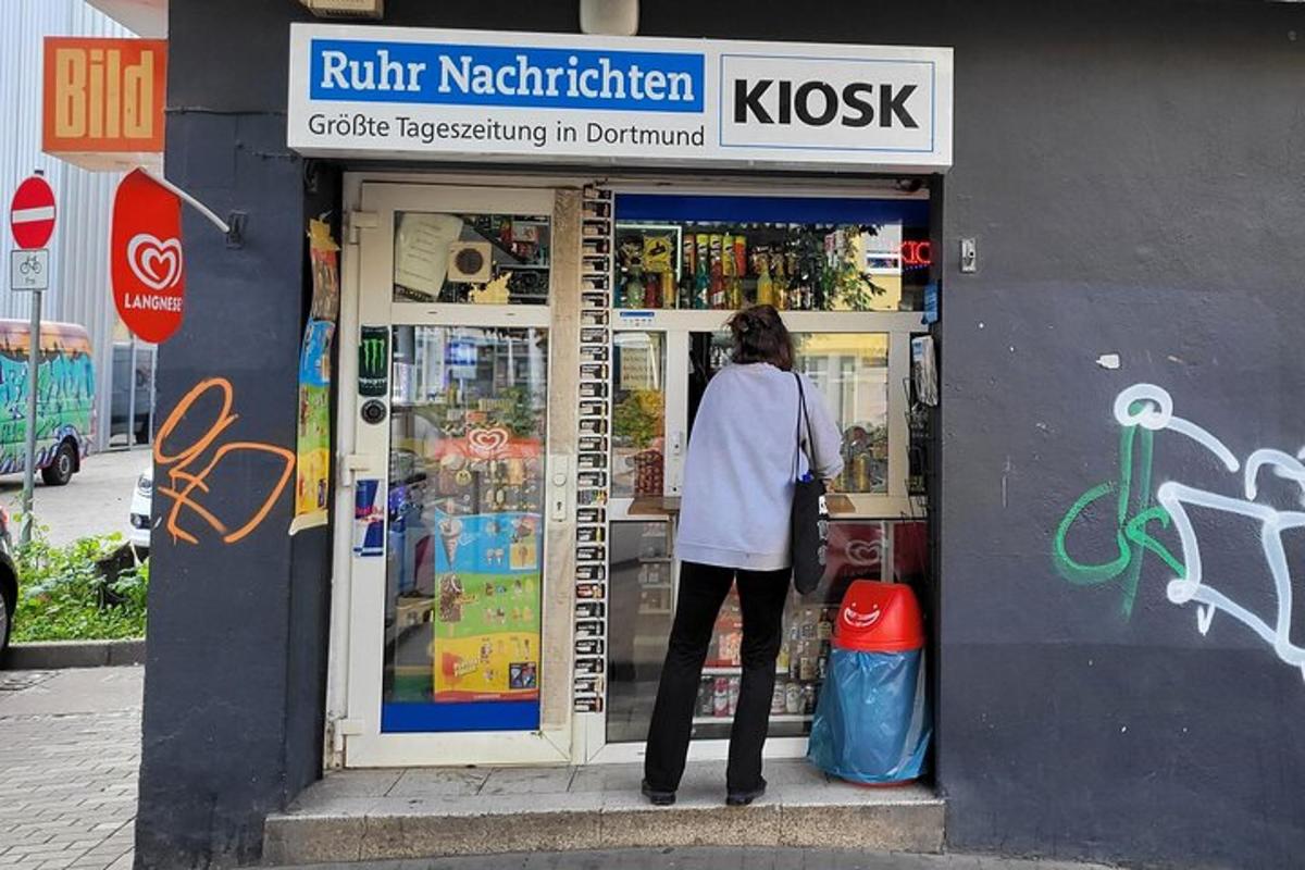 a woman standing in the doorway of a store
