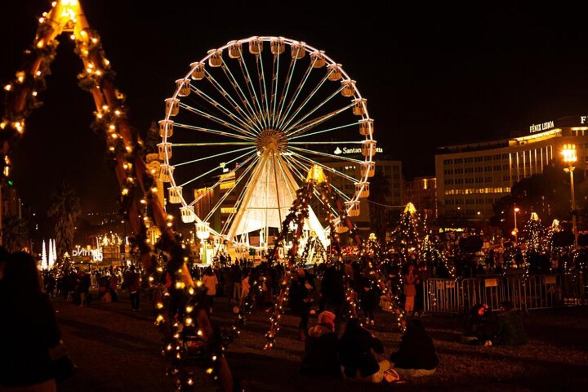 a large ferris wheel in a city at night