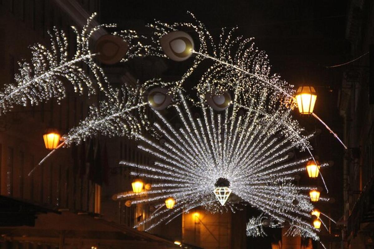 a christmas light decoration on a city street at night
