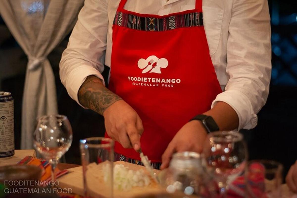 a man in a red apron is cutting food