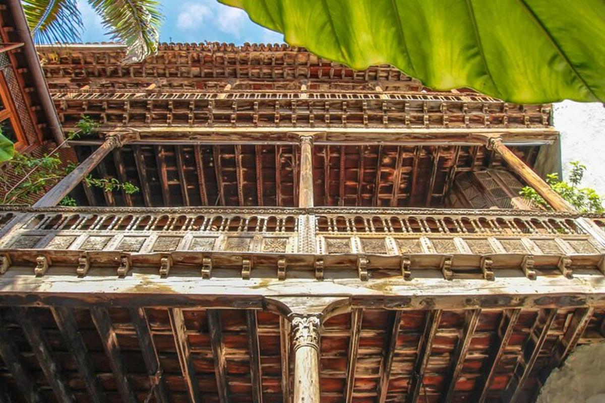a tall wooden building with a roof
