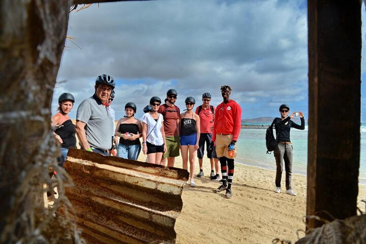 a group of people standing on the beach