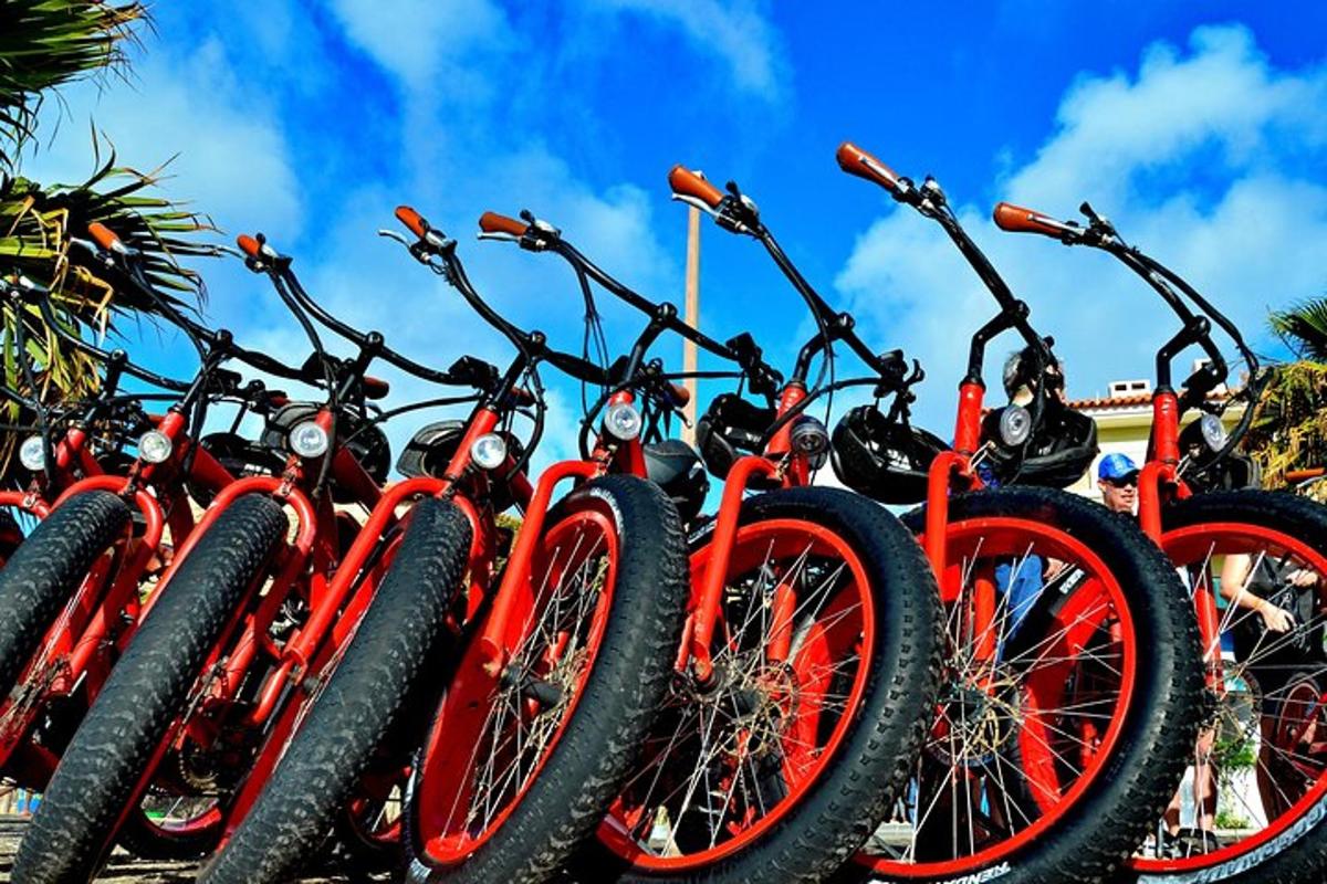 a row of red bikes parked next to each other