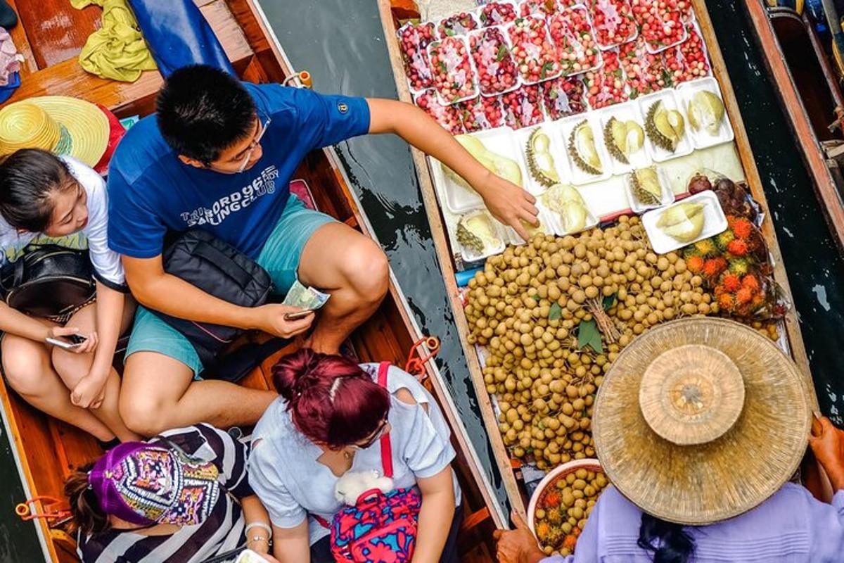 a group of people sitting in a boat at a market