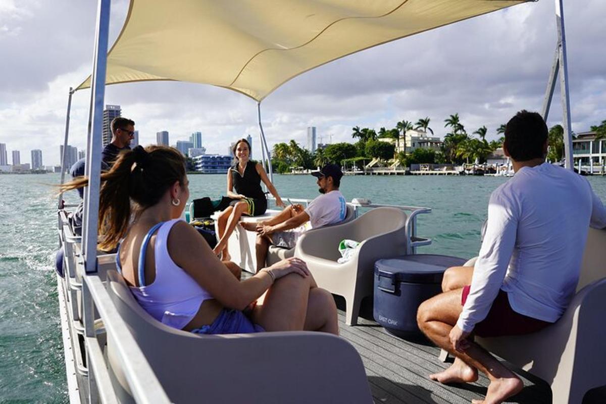 a group of people sitting on a boat in the water