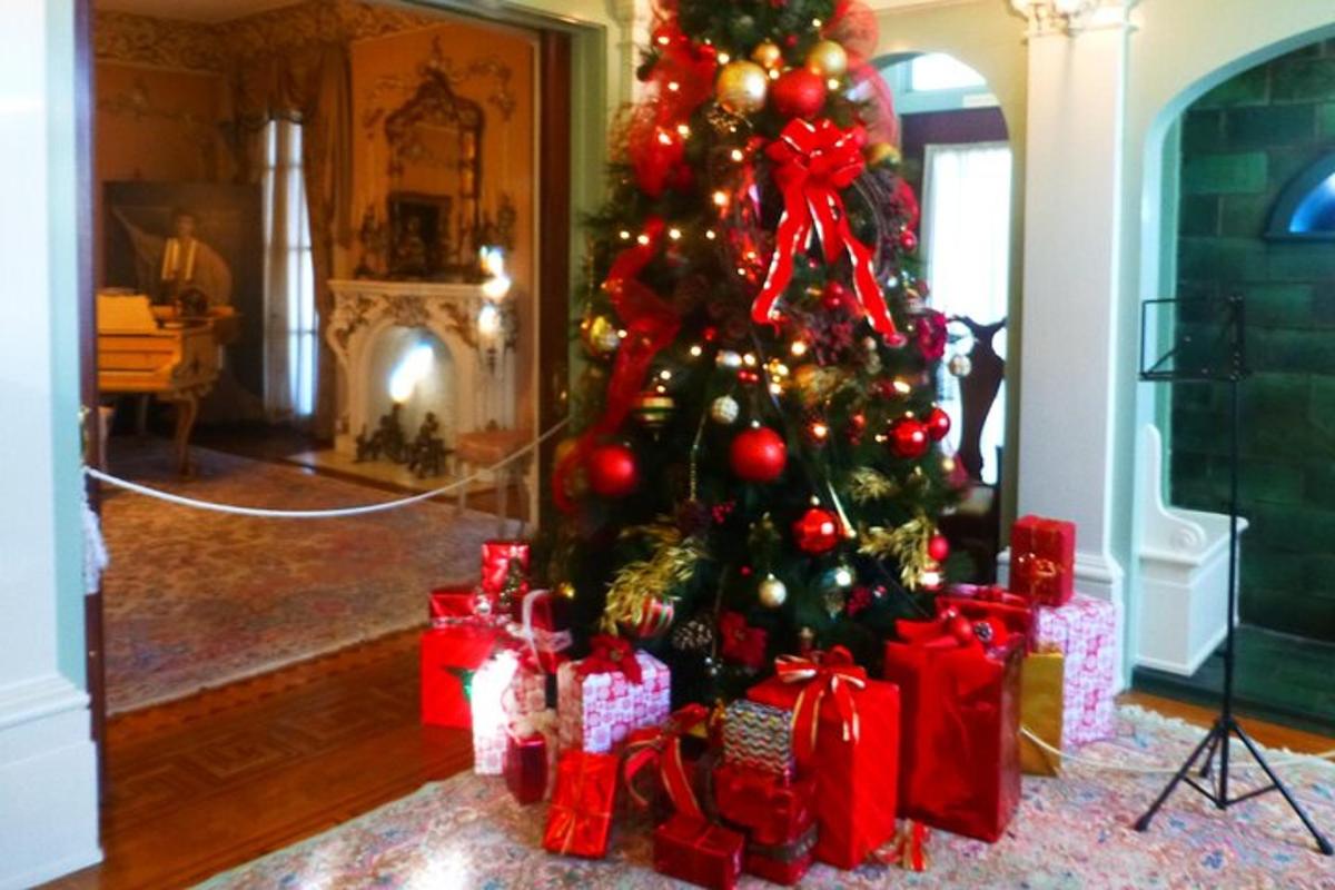 a christmas tree with presents under it in a room