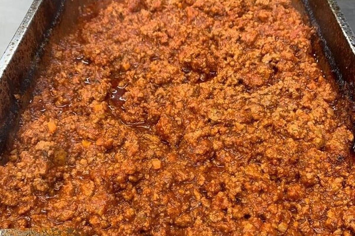 a casserole dish of food with sauce in it