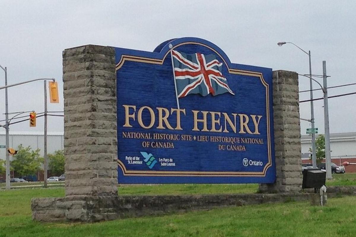 a sign for the fort henry national historic site with the flag of canada