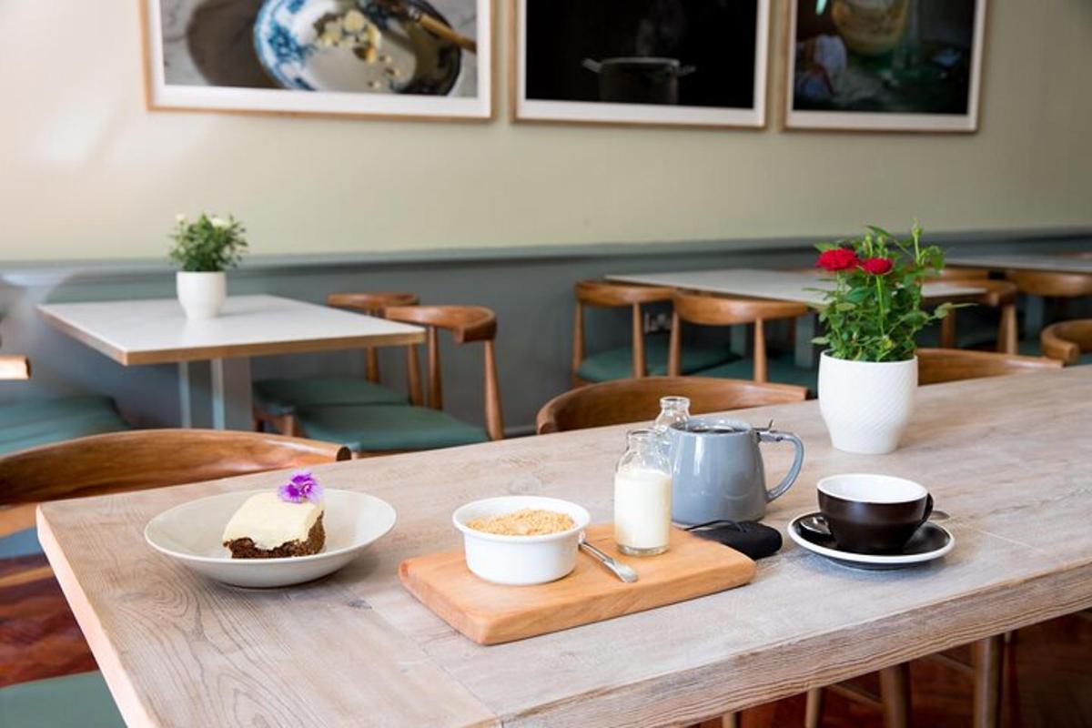 a wooden table with a piece of cake on it