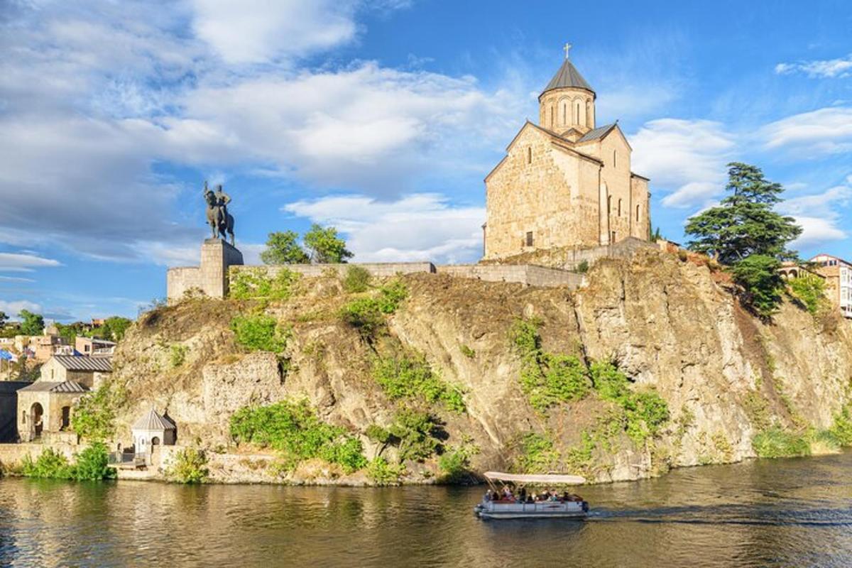 a boat on the river in front of a castle