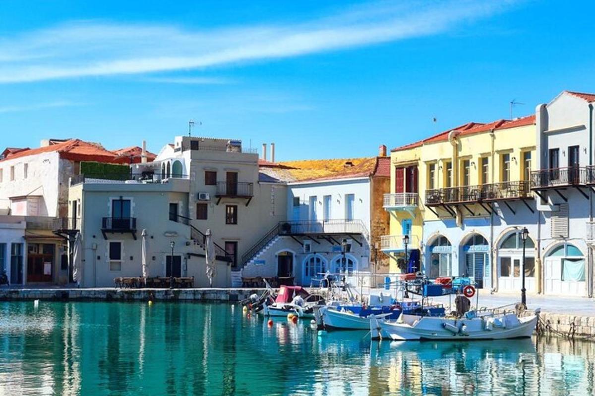 a group of boats docked in a harbor with buildings