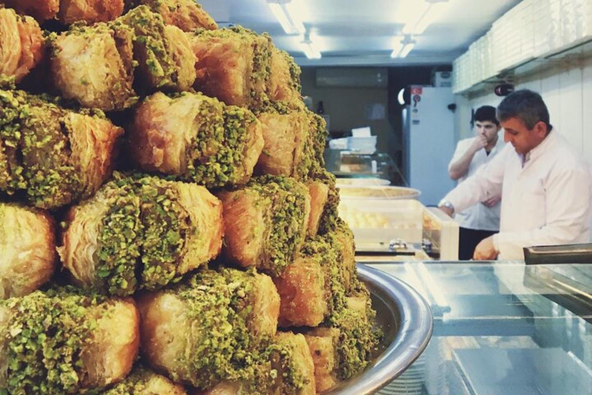 a pile of food with broccoli on top of it