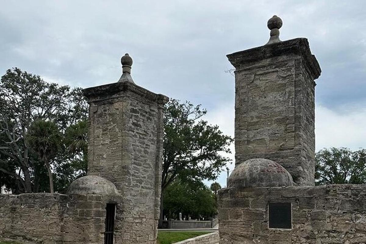two towers on top of a stone wall