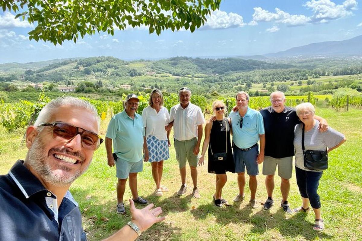 a group of people posing for a picture in a field