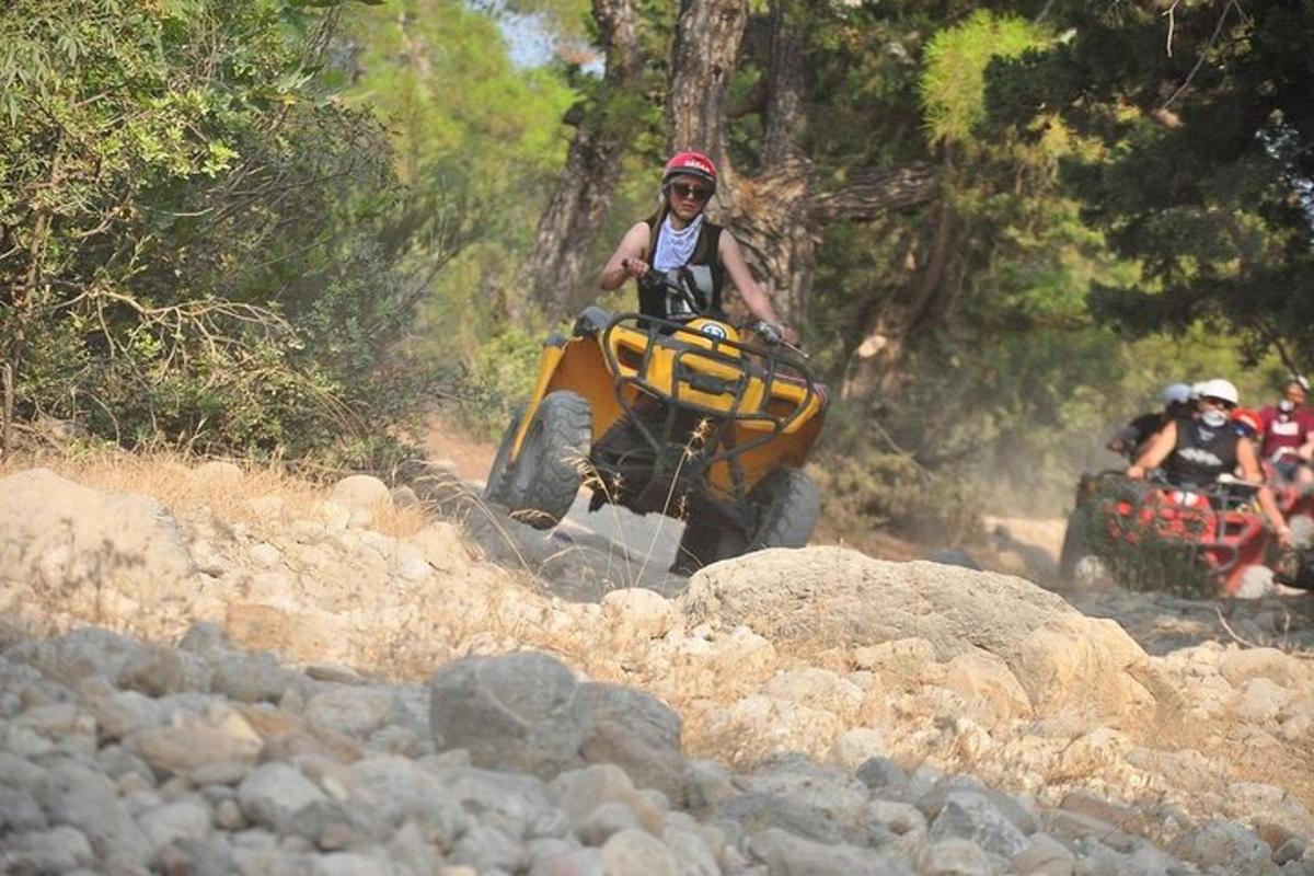 a person on an atv on a rocky trail