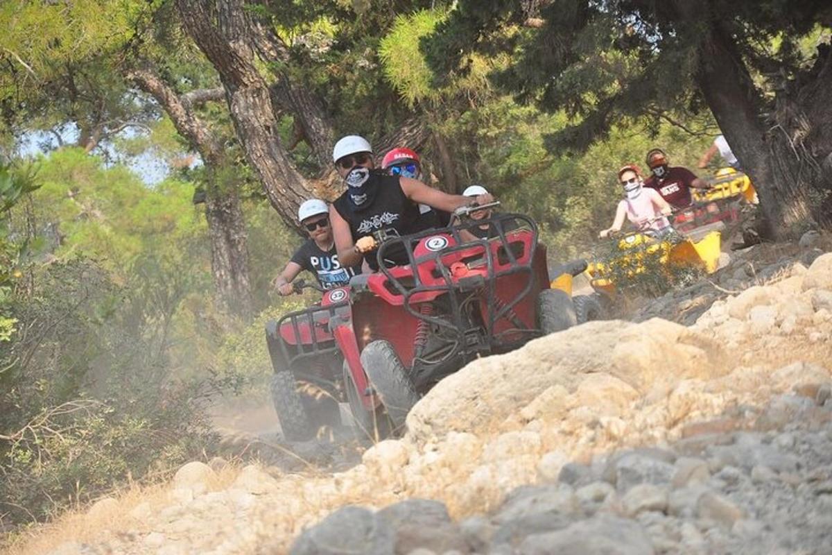 a group of people riding on atvs on a trail
