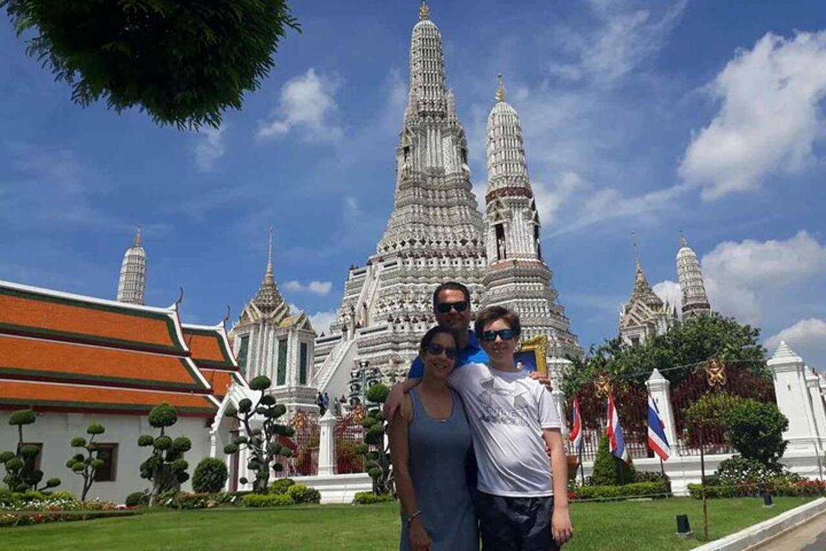 a man and a woman standing in front of a building