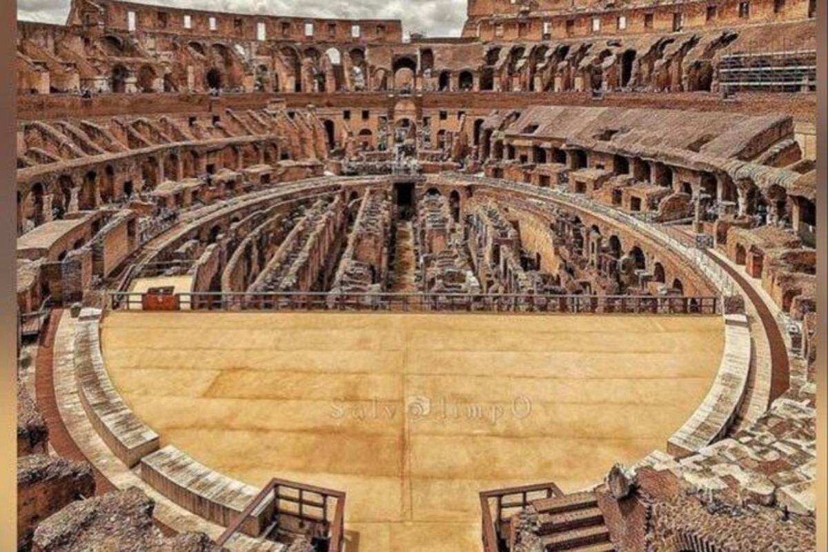 an empty amphitheatre in a building with a large arena