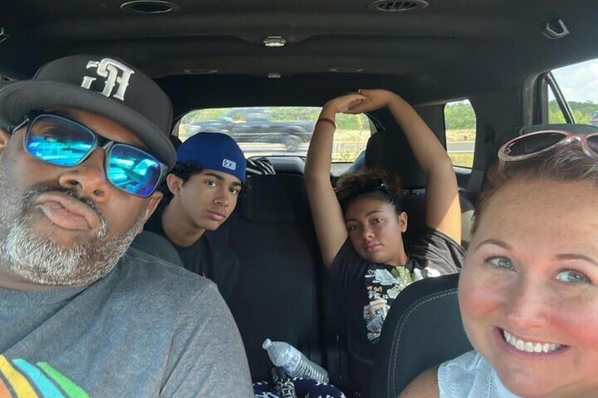 a group of people sitting in the back of a car
