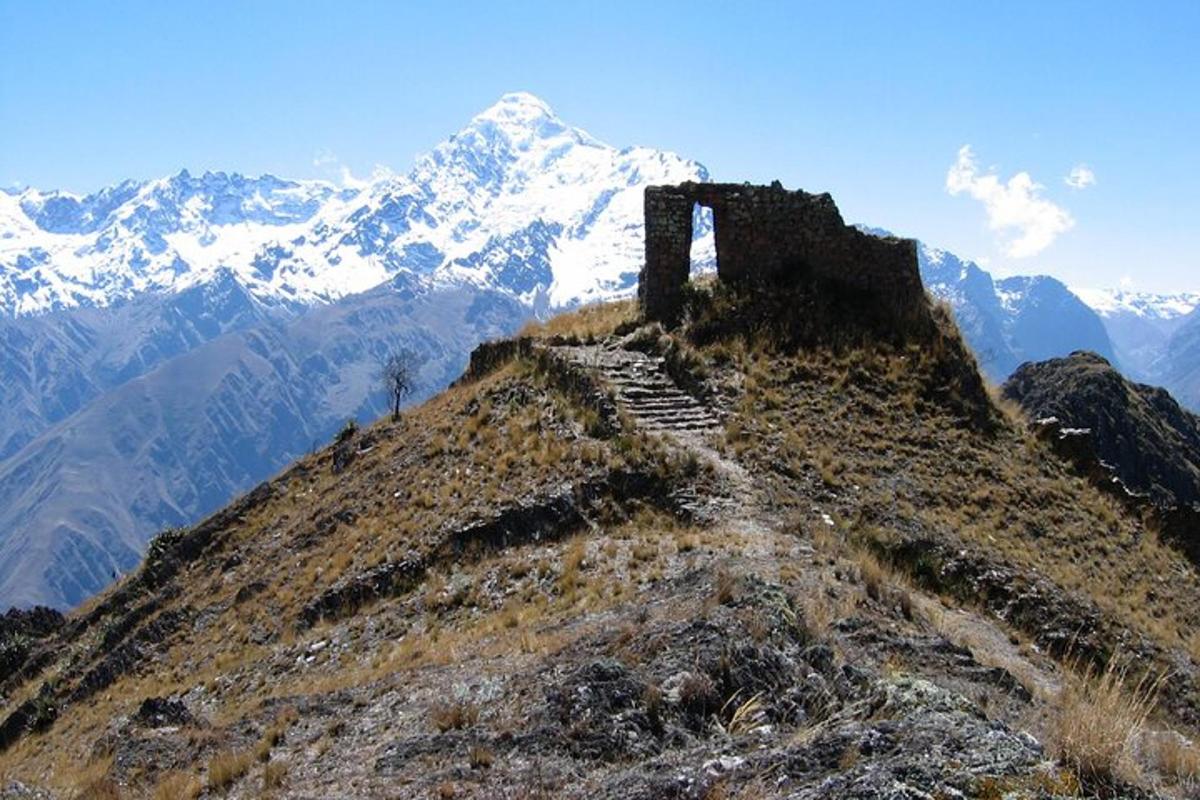 a stone building on the side of a mountain
