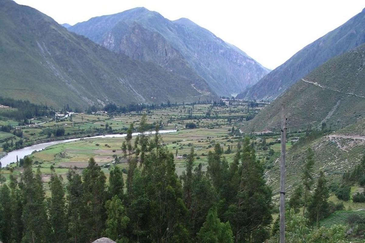 a view of a valley with a river and mountains