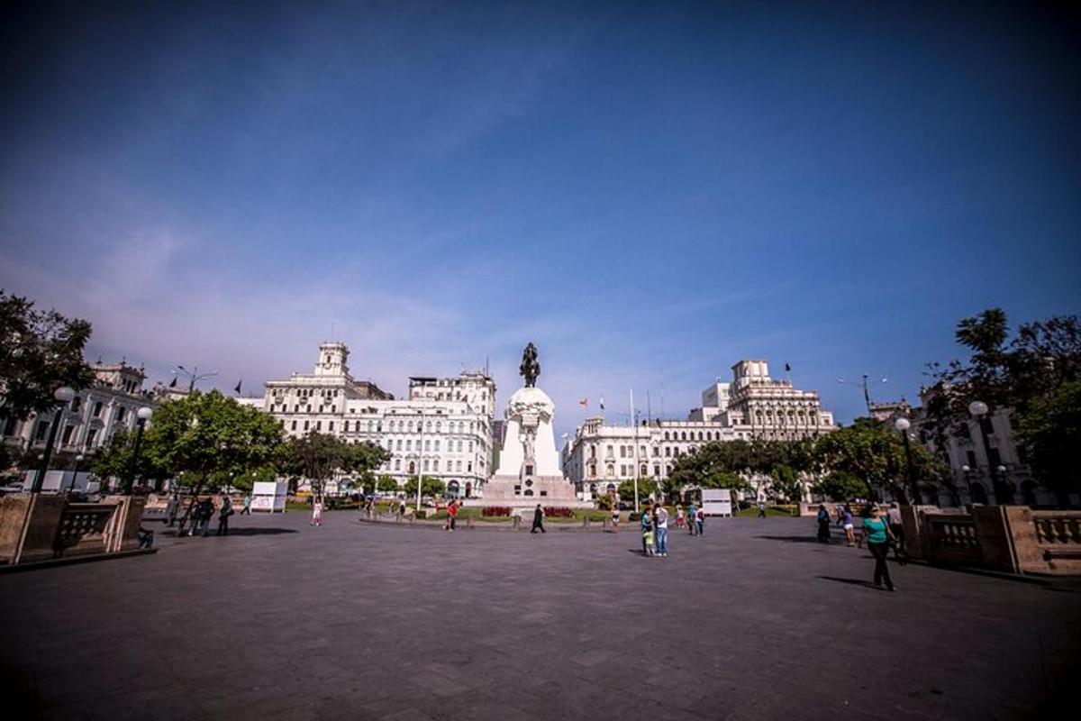 a large plaza in front of a building with a statue