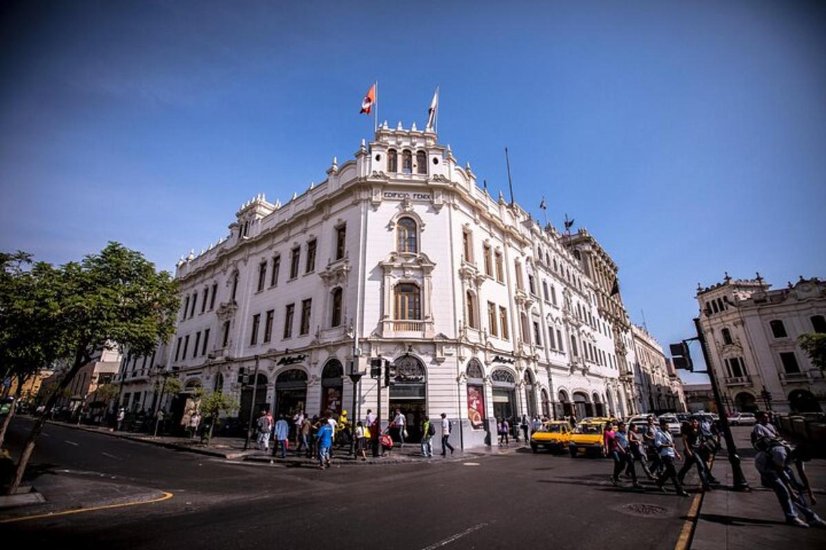 a large white building with a flag on top of it