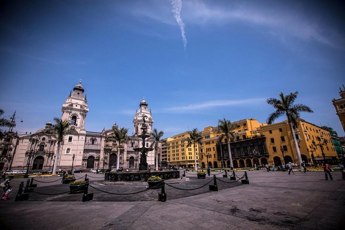 a large building with palm trees in front of it
