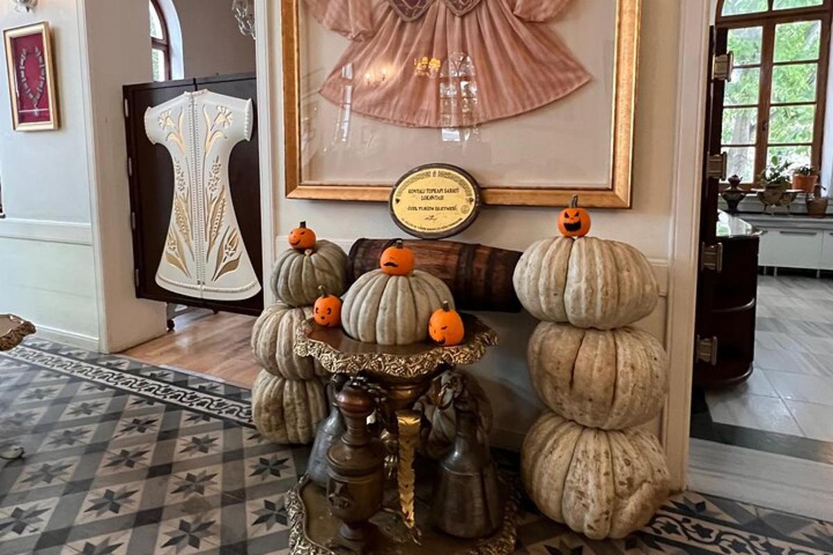 a display of pumpkins on a table in a room