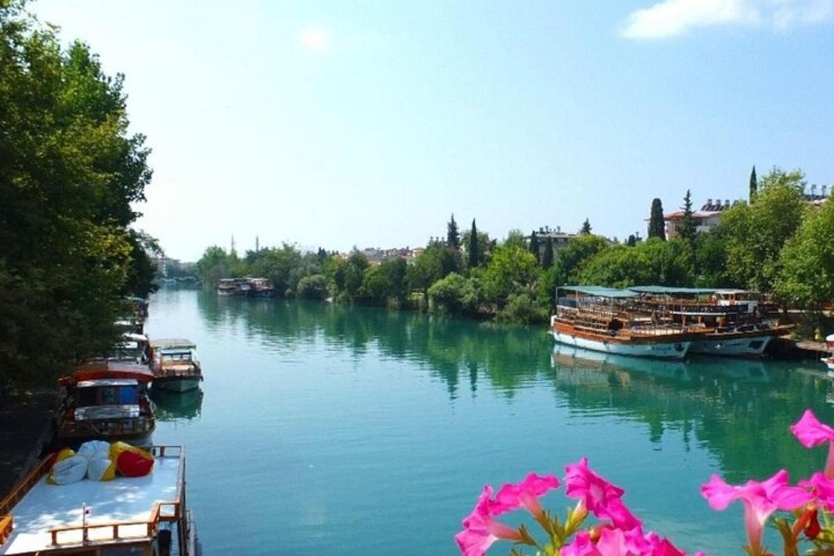 a river with boats docked on the side of it