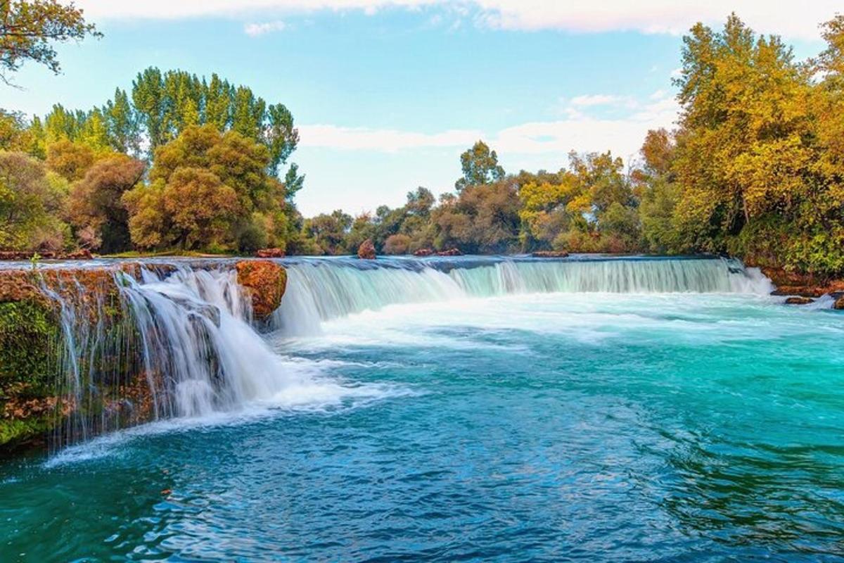 a waterfall in the middle of a river
