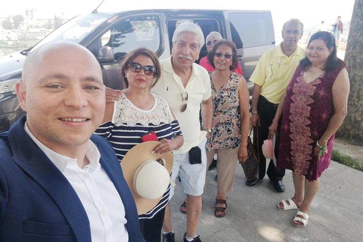 a group of people standing in front of a van