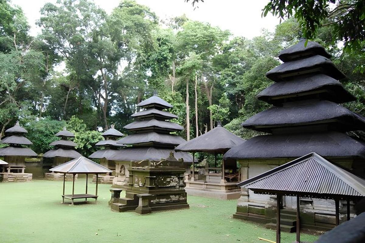 a group of pagodas in a park with trees