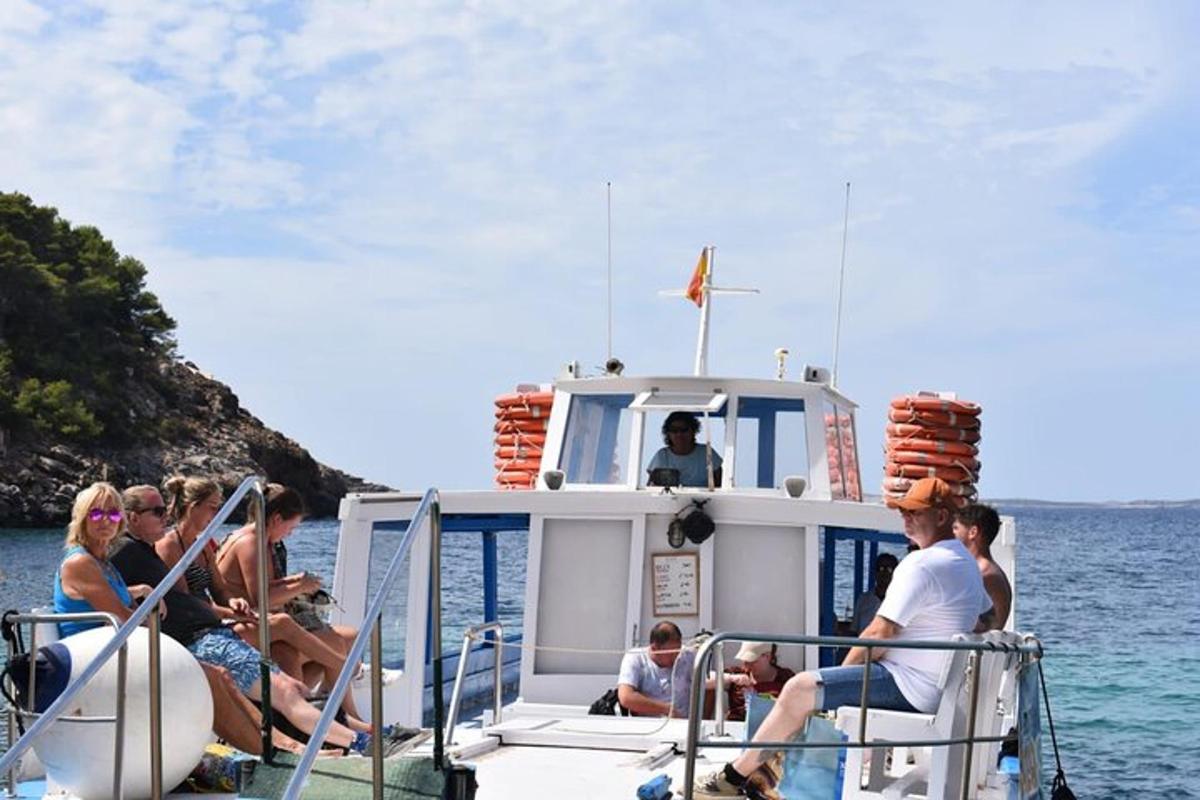 a group of people on a boat in the water