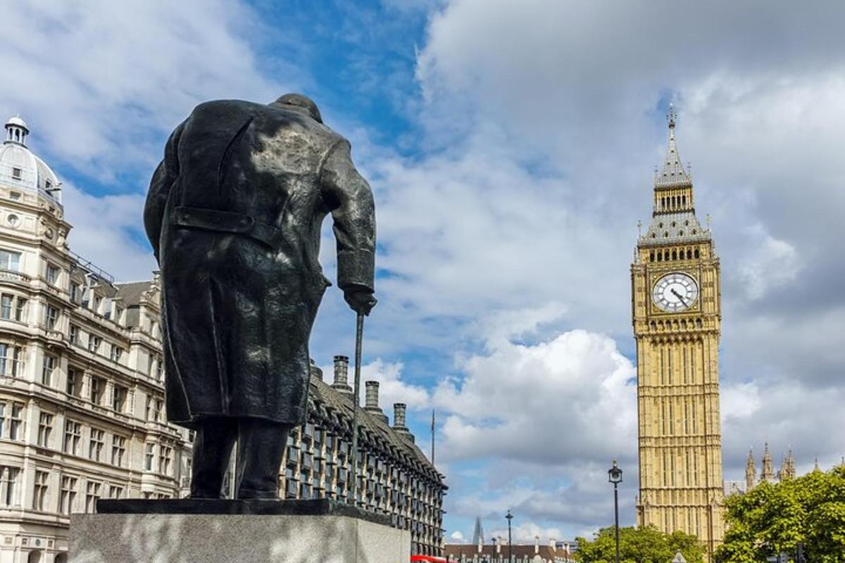 a statue in front of a clock tower and big ben